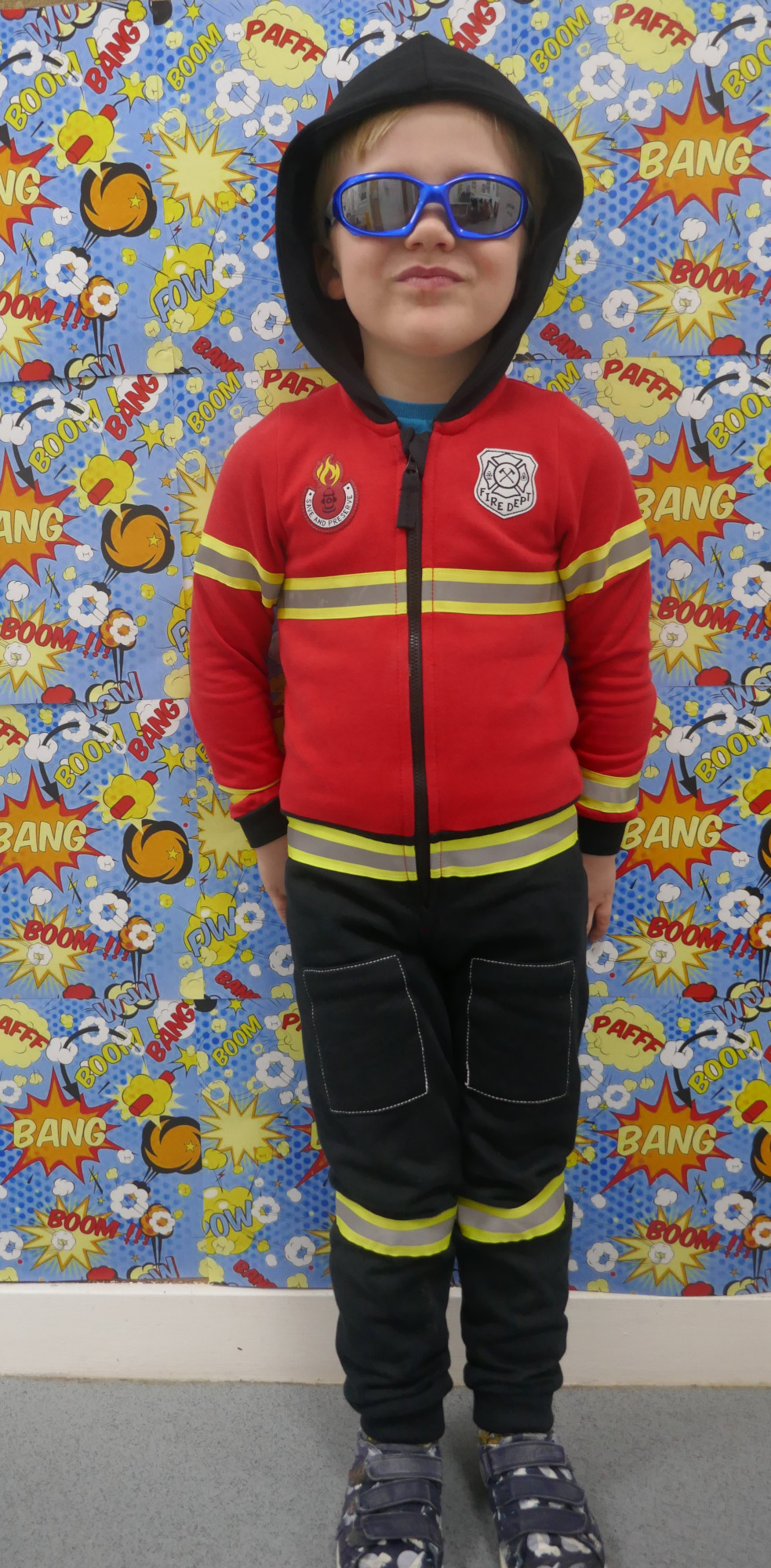 Little boy dressed up as fire man