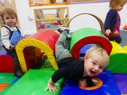 Children playing with soft play