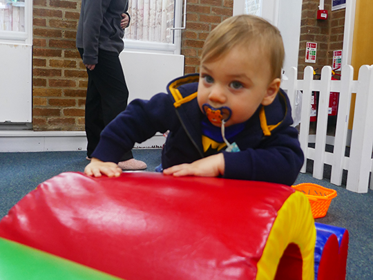 Child playing with soft play