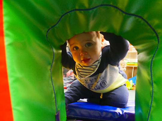 Child playing with soft play